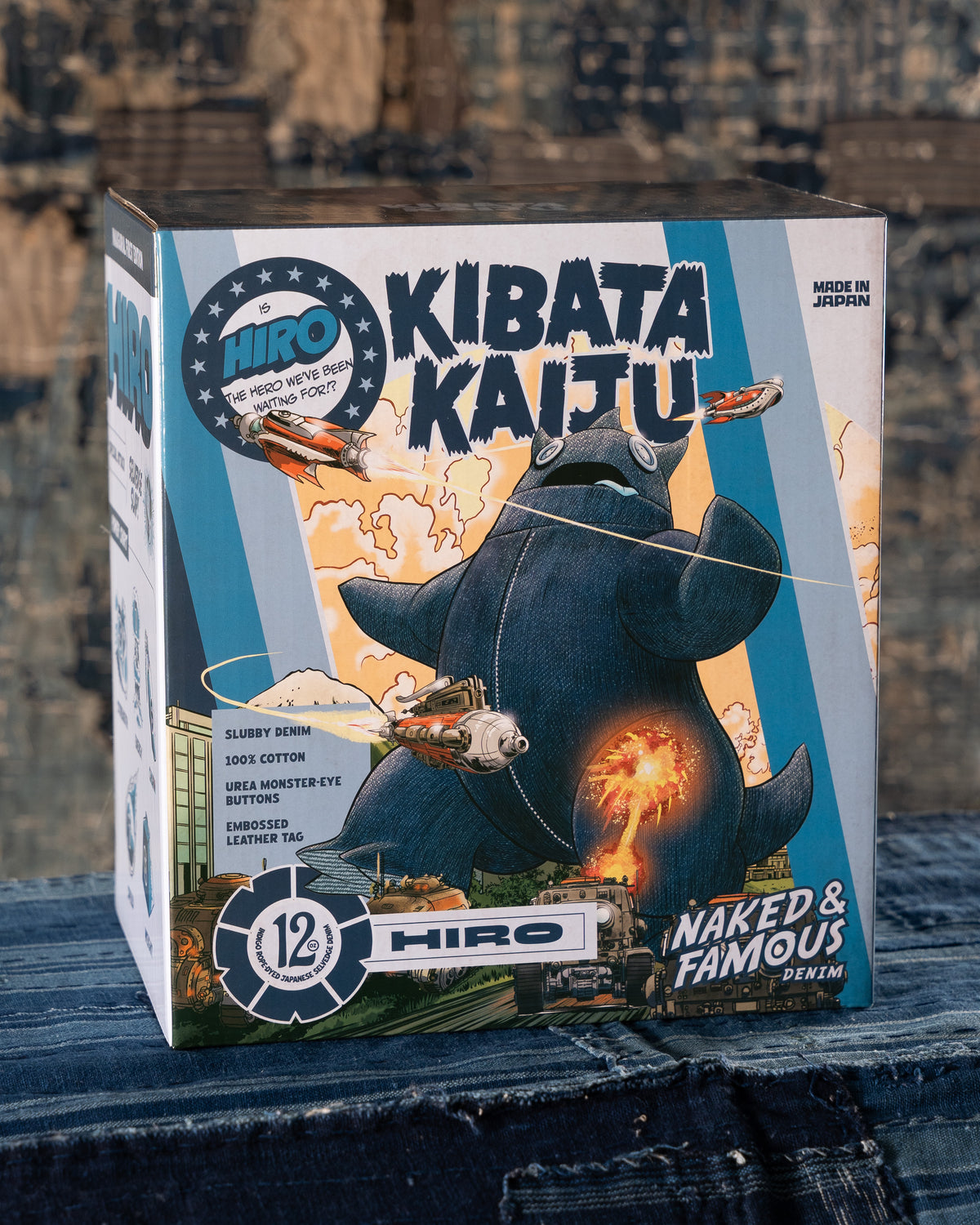 Product packaging for 'Kibata Kaitju' with a blue and white design on a wooden surface.